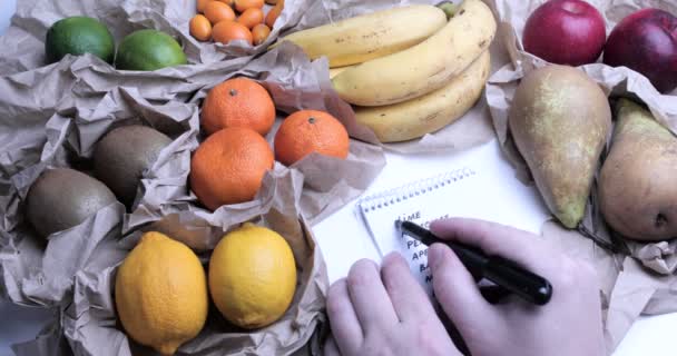 Person Checking Shopping List — Stock Video