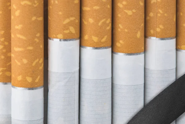 Long Row Cigarettes Orange Filter Tips — Stock Photo, Image