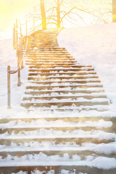 Wooden staircase with snow covered, into the light — Stock Photo, Image