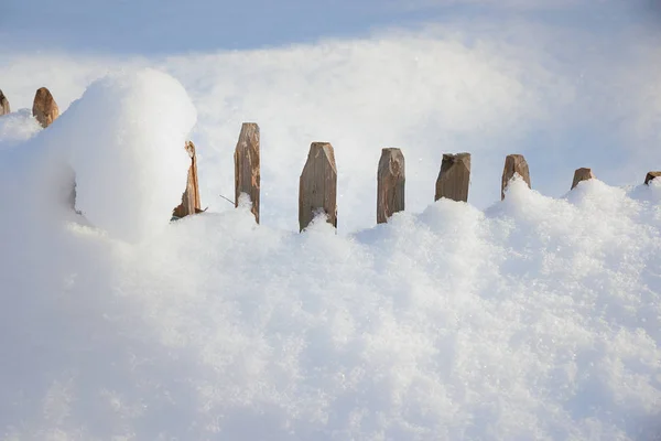 Fresh fallen powder snow and snowbound fence — Stock Photo, Image