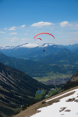 view from nebelhorn mountain to oberstdorf, bavarian spring land clipart