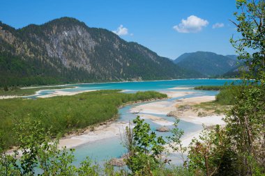 isar river flows into lake Sylvenstein, bavarian landscape. summer landscape germany clipart