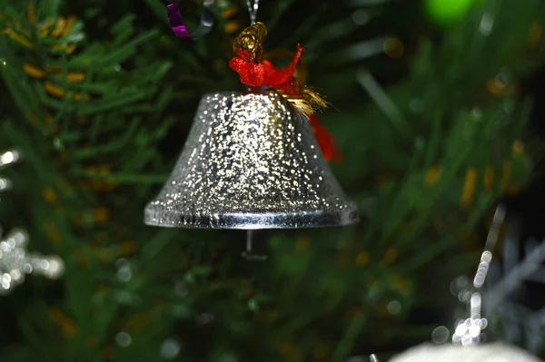 Retro silver bell on green background.