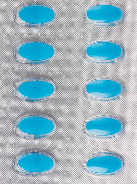 Zamknięty tabletka leku niebieski w przezroczyste blistry — Zdjęcie stockowe