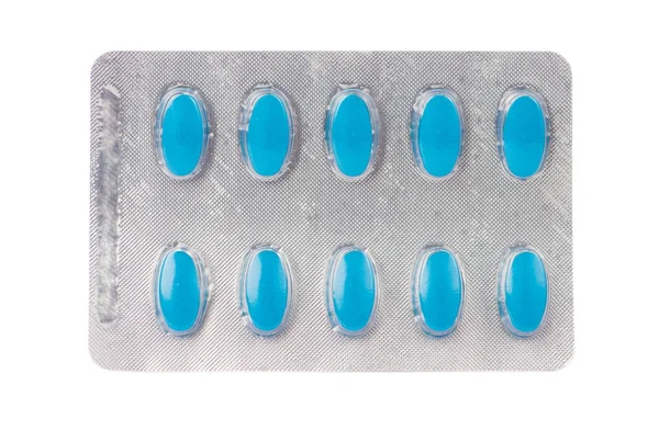 Comprimé médicinal bleu en plaquette thermoformée transparente sur blanc — Photo