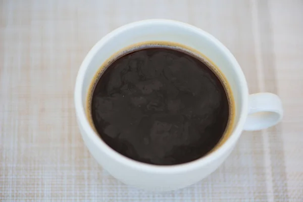 Closed up black coffee in white cup — Stock Photo, Image