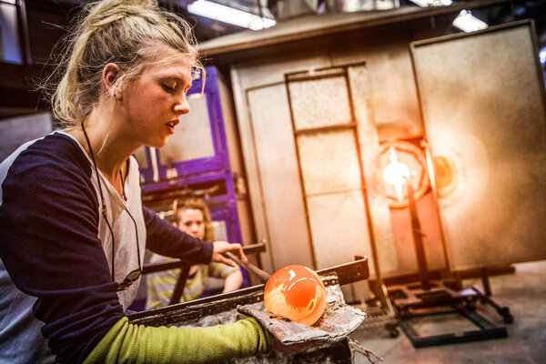 Glass Blowing Workshop - Two Women Shaping glass on the Blowpipe