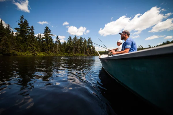 Son and Father Fishing in a Calm Lake — Stock Photo, Image