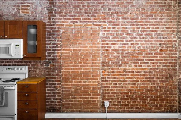 Industriële bakstenen muur perspectief in een keuken — Stockfoto