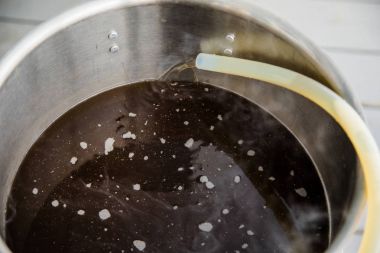 Pouring Brew Beer into the Boil Kettle clipart