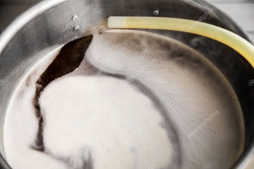 Pouring Brew Beer into the Boil Kettle
