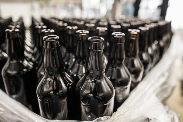 Stacked empty beer bottles — Stock Photo, Image