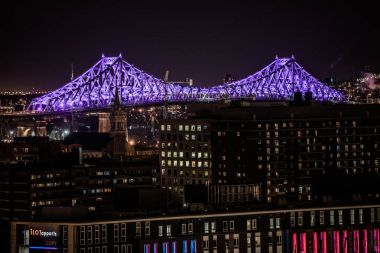 Montreal, Canada - November 21, 2017: Illuminated (by Moment Factory) Jacques-Cartier Bridge at Night from an Elevated Point of View. clipart