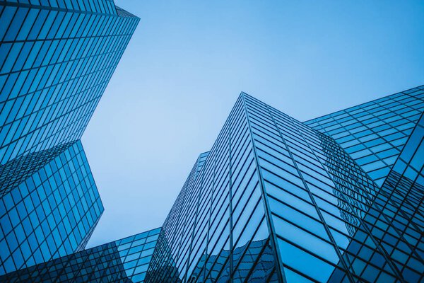 Abstract and Complex Blue Skyscraper Structure Downtown in Montreal with Sky in Background