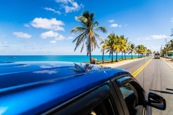 View to sunny street from above a car in Caribbean San-Andres island.