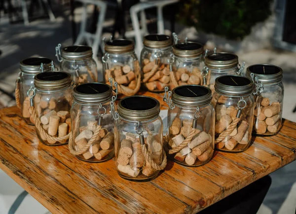Decorative jars filled with wine corks. Subject photo.