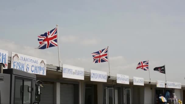 Flags over shops — Stock Video