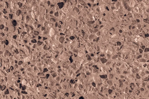 Raue Oberfläche aus Steinkiesel braune Farbe — Stockfoto