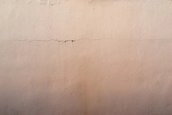 Abstract textured apricot background of the old plastered surface — Stock Photo, Image