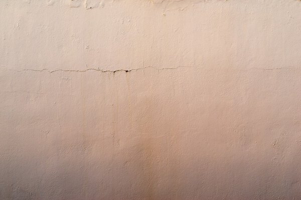 абстрактный текстурированный абрикосовый фон старой штукатурки
