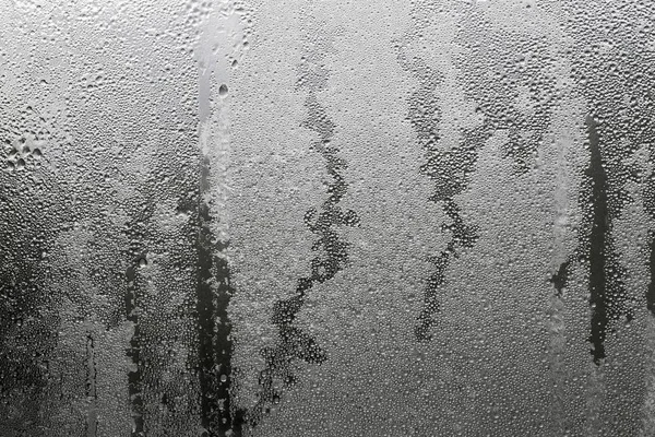 Abstrakte Textur des nassen Glases schwarz graue Farbe — Stockfoto