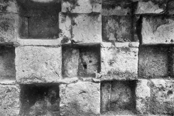 Old abstract surface of a stone wall monochrome tone — Stock Photo, Image