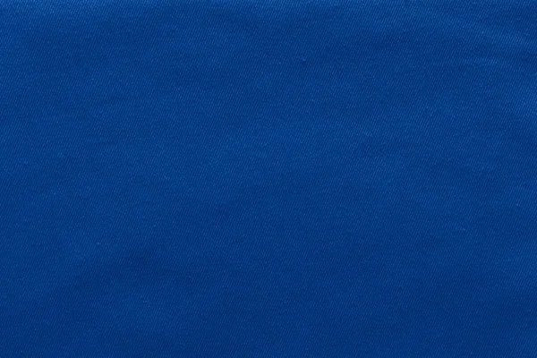 Textured background of denim fabric dark blue color — Stock Photo, Image