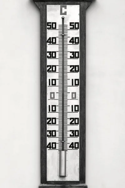 Big thermometer on a wall monochrome tone — Stock Photo, Image