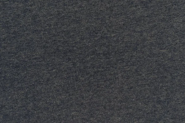 Текстурированный фон из трикотажа темного цвета — стоковое фото