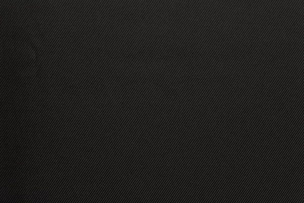 Текстурированный фон черного цвета ткани — стоковое фото
