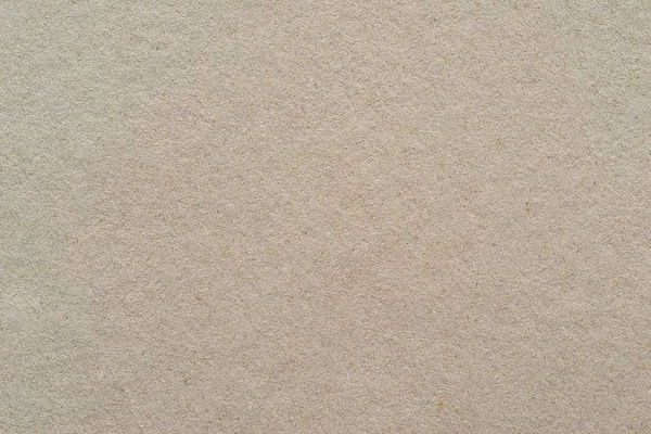 Textuur van een karton of papier materiaal van beige kleur — Stockfoto