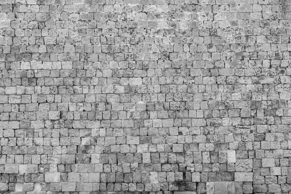Textur einer alten und alten Steinmauer — Stockfoto
