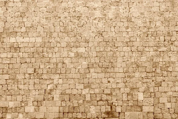 Textura de un viejo y antiguo muro de piedra —  Fotos de Stock