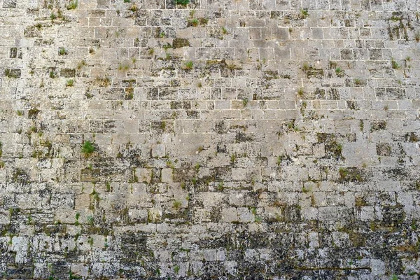 Rough texture of an old stone wall — Stock Photo, Image