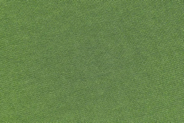Groene textuur van gebreid materiaal — Stockfoto