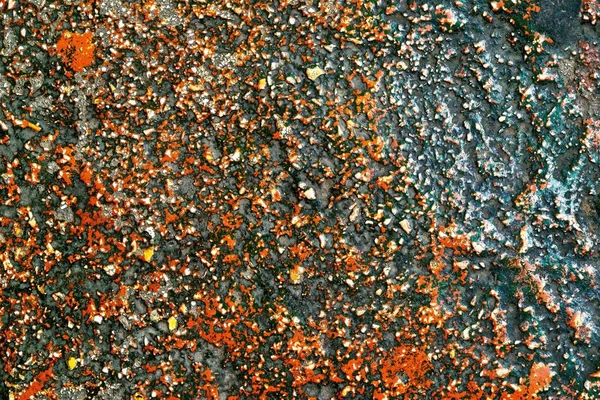 Грубая пестрая и гранулированная поверхность камня — стоковое фото