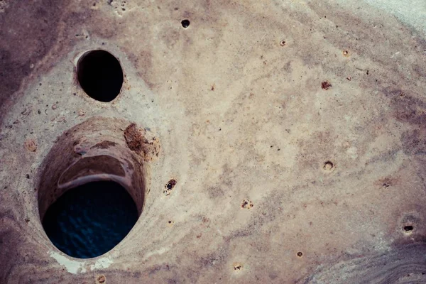 Abstract texture of a stone with holes — Stock Photo, Image