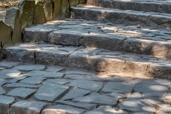 old ancient staircase with stone steps outdoors closeup for an abstract background