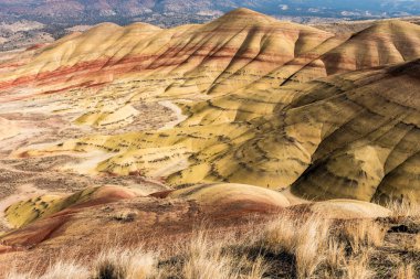 Views of the arid and colorful landscape of Painted Hills clipart