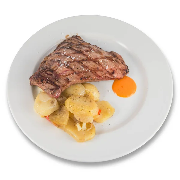 Plato de presa de cerdo ibérico con rodajas de patata al horno . — Foto de Stock
