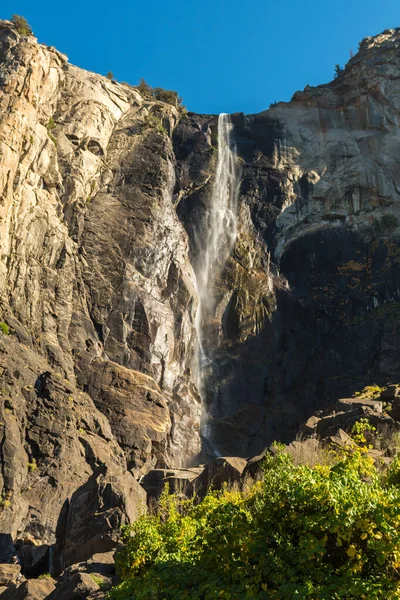 View of the Bridalveil waterfall seen from below in Yosemite National Park, California, USA — стоковое фото