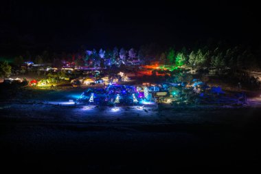Night view of the festival Psytrance Lost Theory in Rio Malo de Abajo in Las Hurdes, Extremadura, Spain clipart