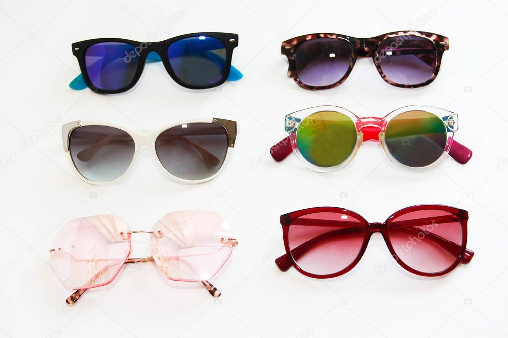 sunglasses with multi-colored lenses and frames on white background