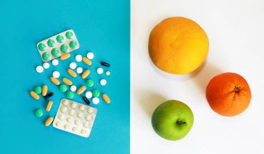 ilaç tabletleri ve meyveler, portakal, greyfurt, elma bir muz