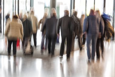 Intentional blurred image of people walking clipart