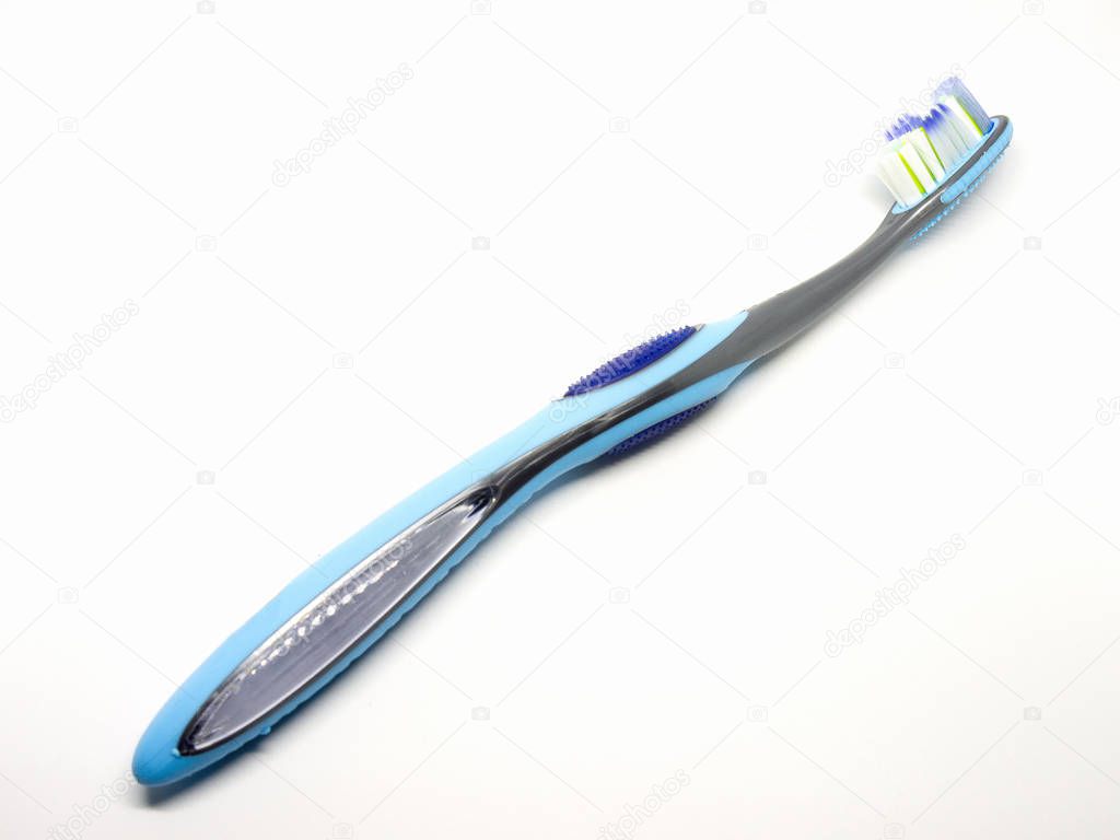 Blue plastic toothbrush on a white background.