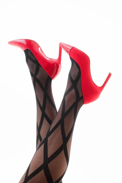 Ноги Девушки Колготках Красными Туфлями Белом Фоне — стоковое фото