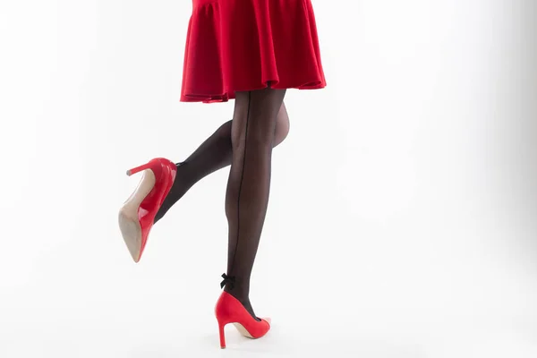 Close Girl Legs Painted Pantyhose Heels Red Dress White Background — ストック写真