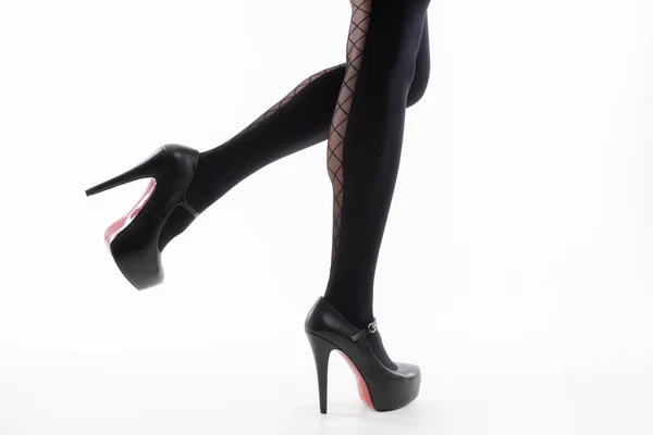 Ноги Дівчини Візерункових Колготках Чорним Взуттям Білому Тлі — стокове фото