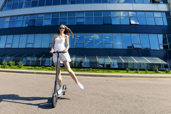 Girl Dress Rides Electric Scooter Modern Buildings — Stock Photo, Image